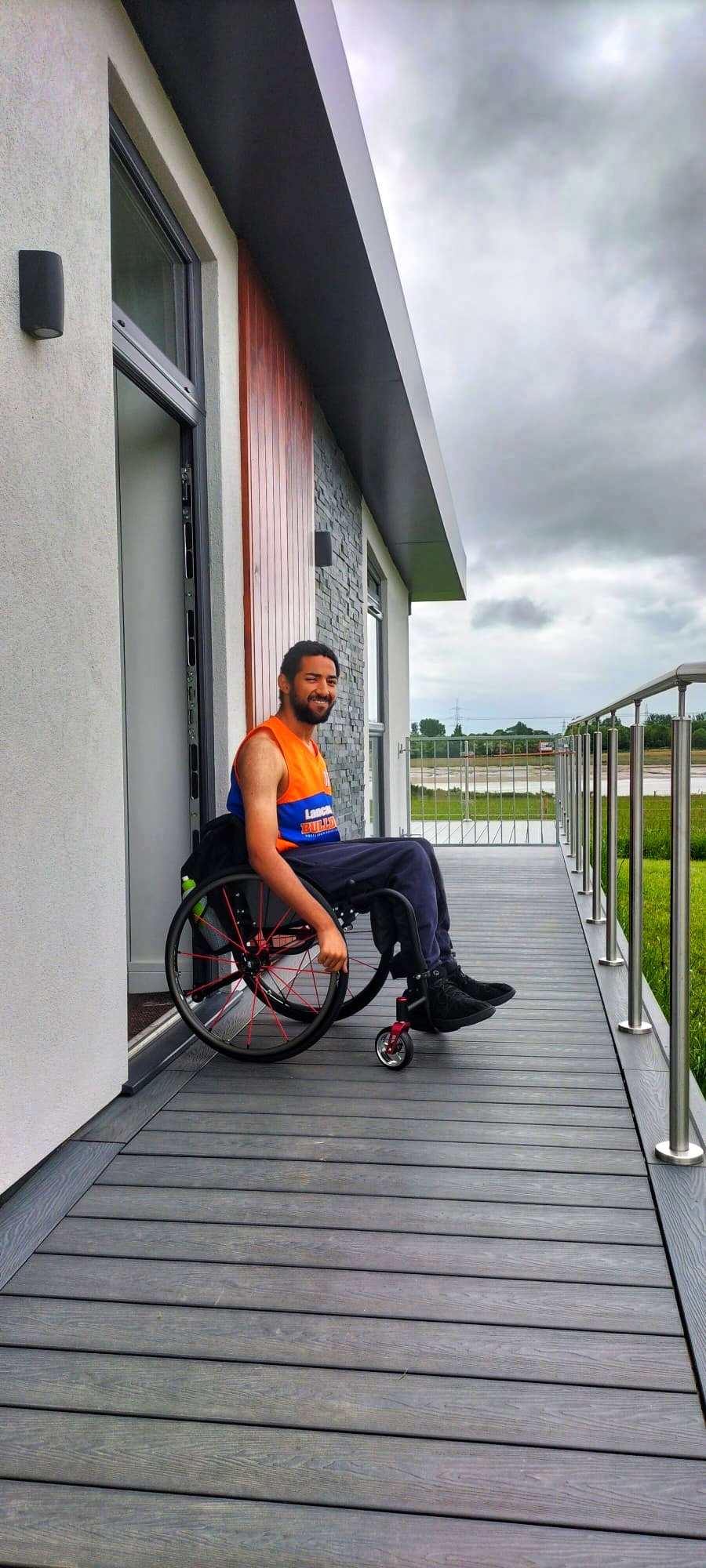 Young man in wheelchair at The Estuary Riverside Chalets