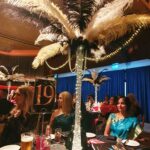 Dalvis Restaurant in Poulton at the Wyre Business Awards in Fleetwood with stunning table decoration in a palm effect with feathers and lights.