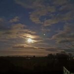 Full moon to the East of The Estuary Riverside Chalets. Some clouds breaking up the skyline